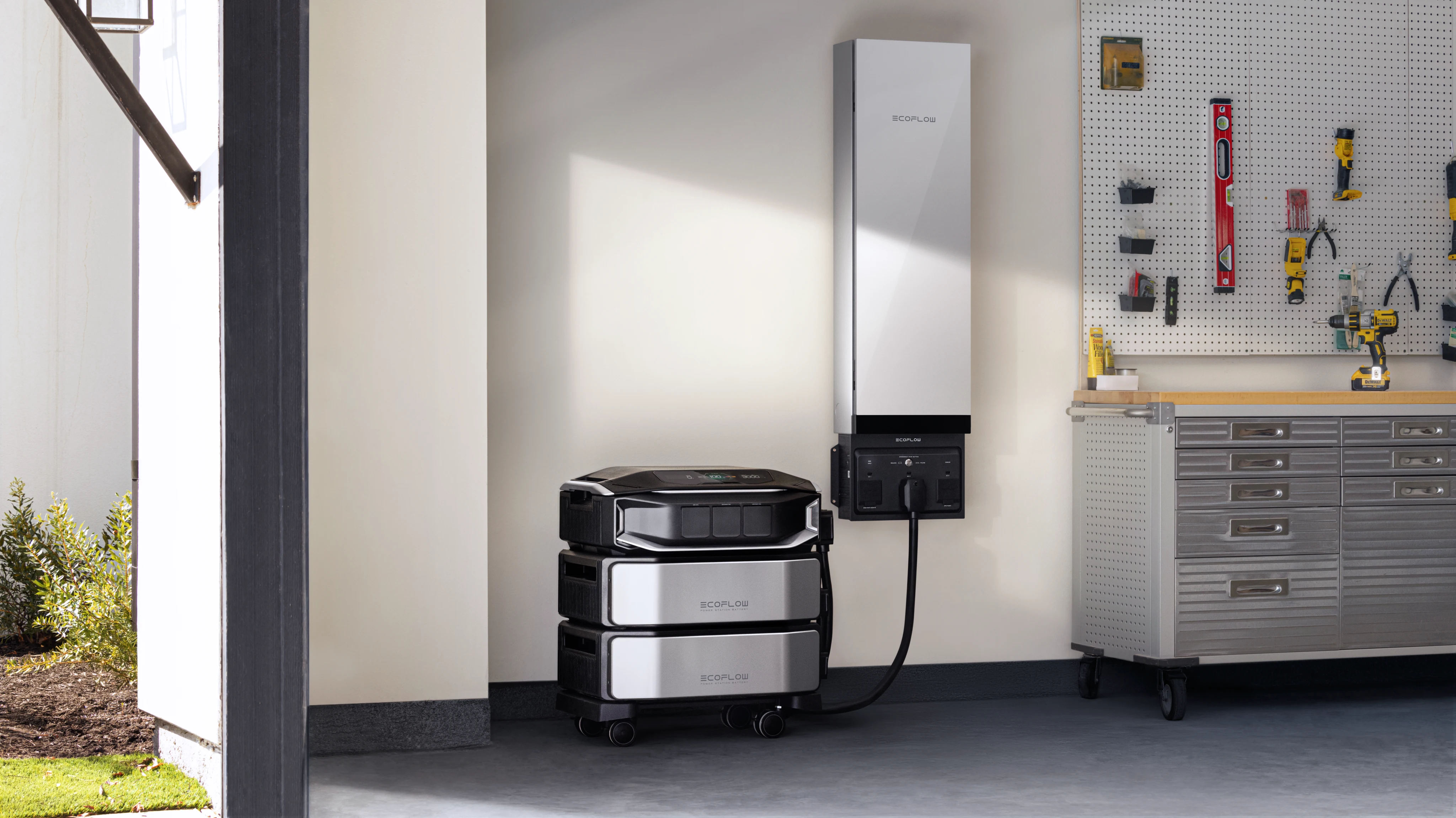 EcoFlow DELTA Pro Ultra X system in a garage workshop, connected to a wall unit for versatile home backup and power needs.