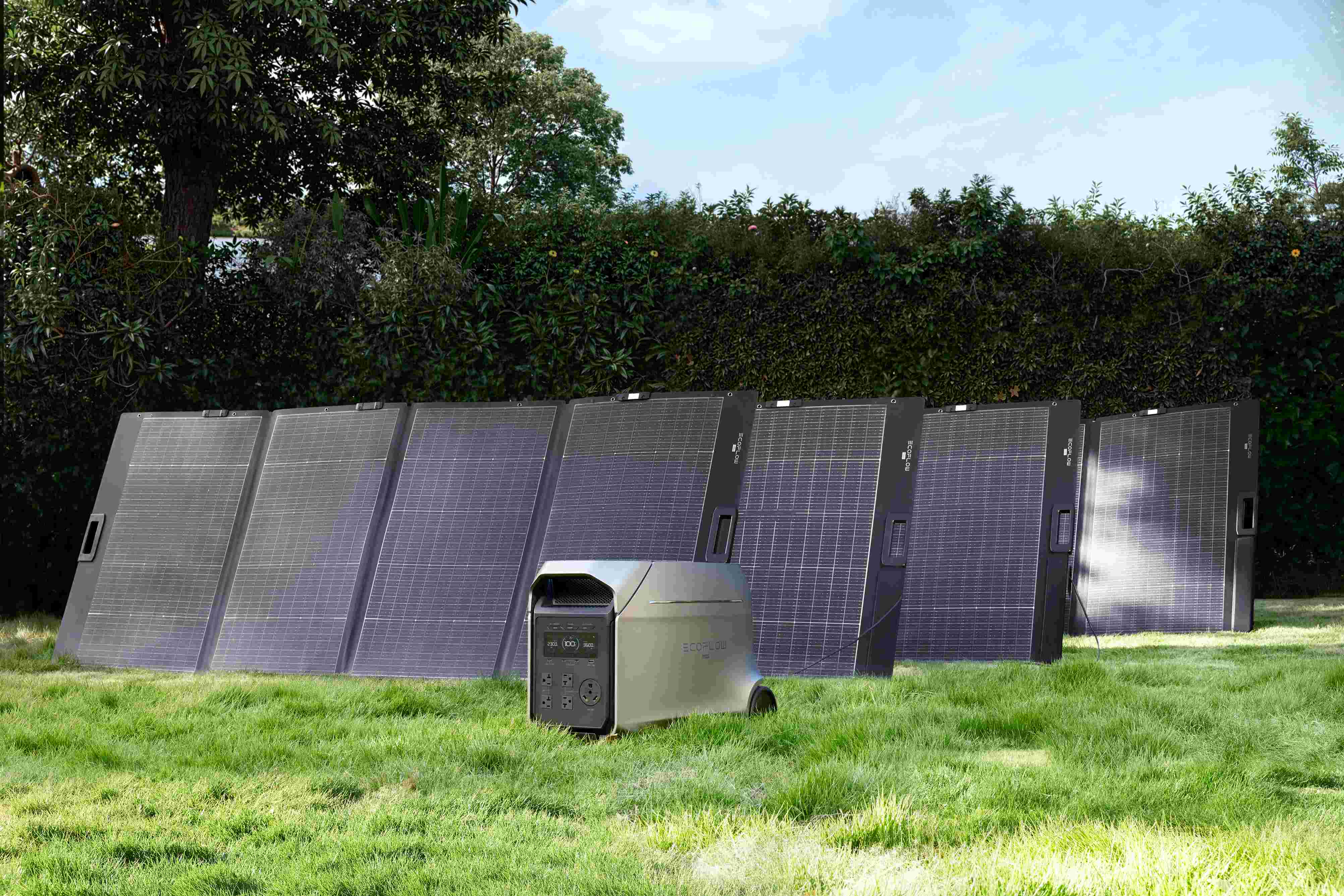 EcoFlow DELTA 3 Ultra energy storage system matched with multiple foldable solar panels on lawn for off-grid outdoor solar power generation