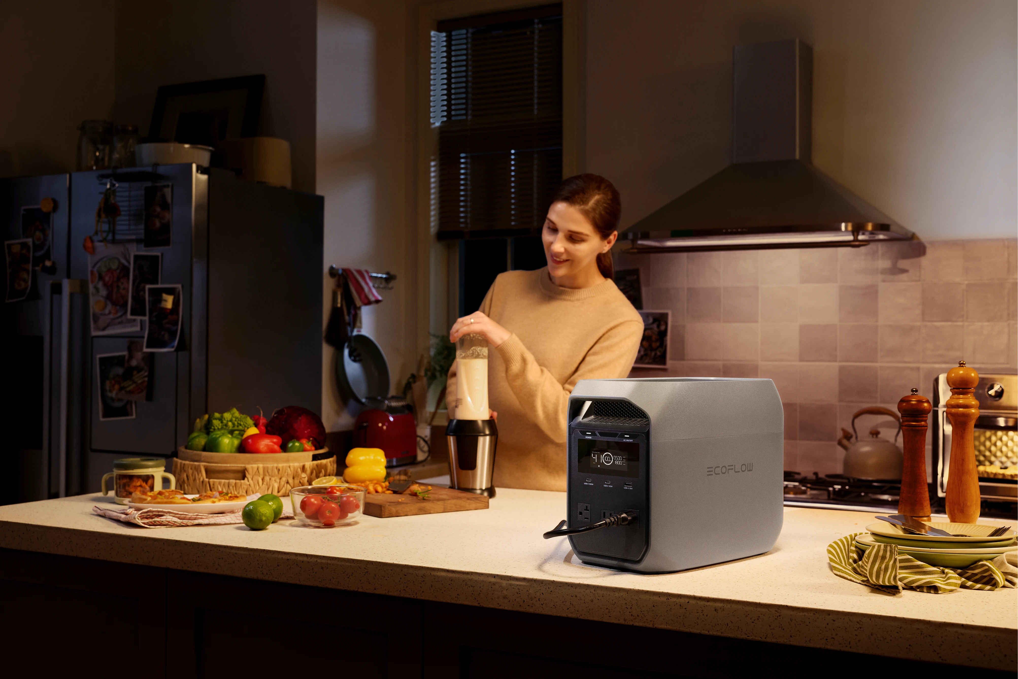 EcoFlow gray home backup power station on kitchen counter powering electric blender, portable battery generator supplies small kitchen appliances during unexpected power outages for daily meal prep